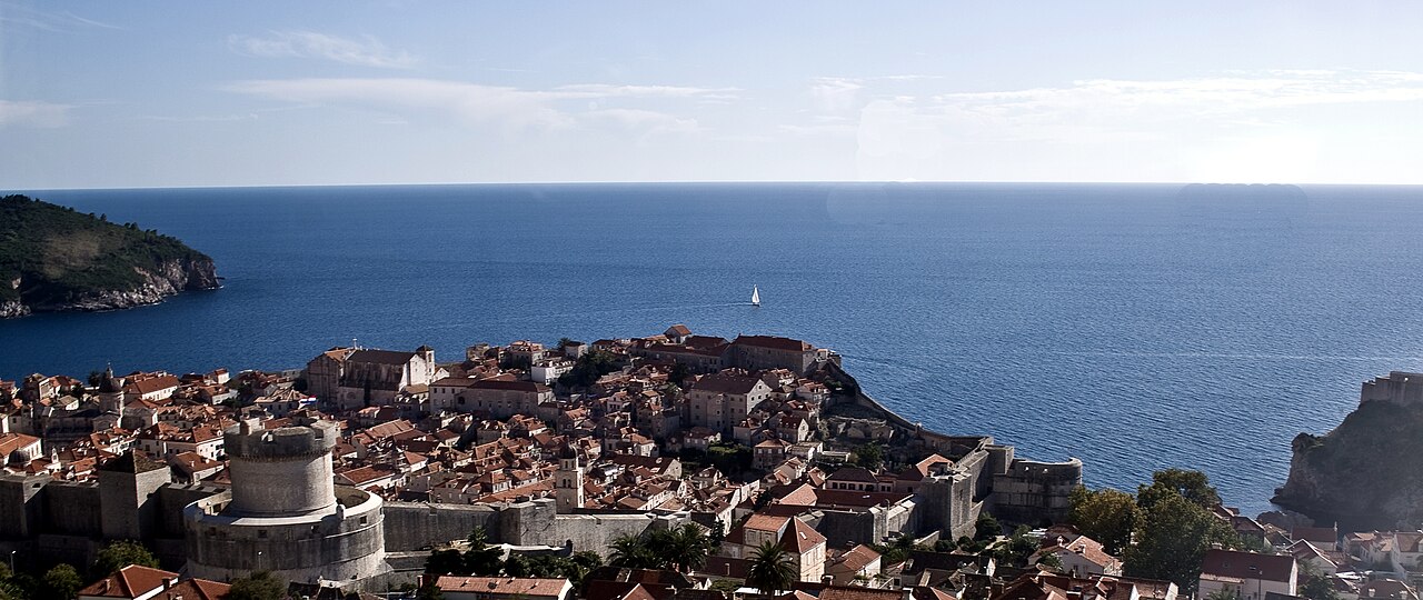 Historic walls and tiled rooftops of Dubrovnik beside the Adriatic Sea