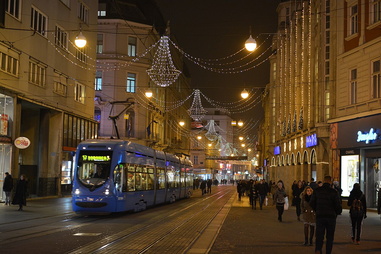 Tram on Ilica Street in Zagreb at night beneath festive lights